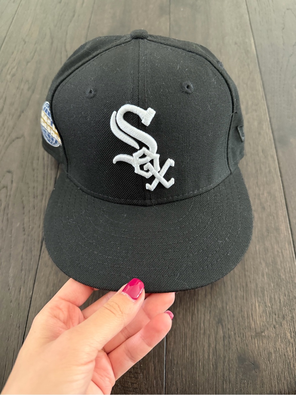 New Era Black Men’s Cap with White Embroidered Logo